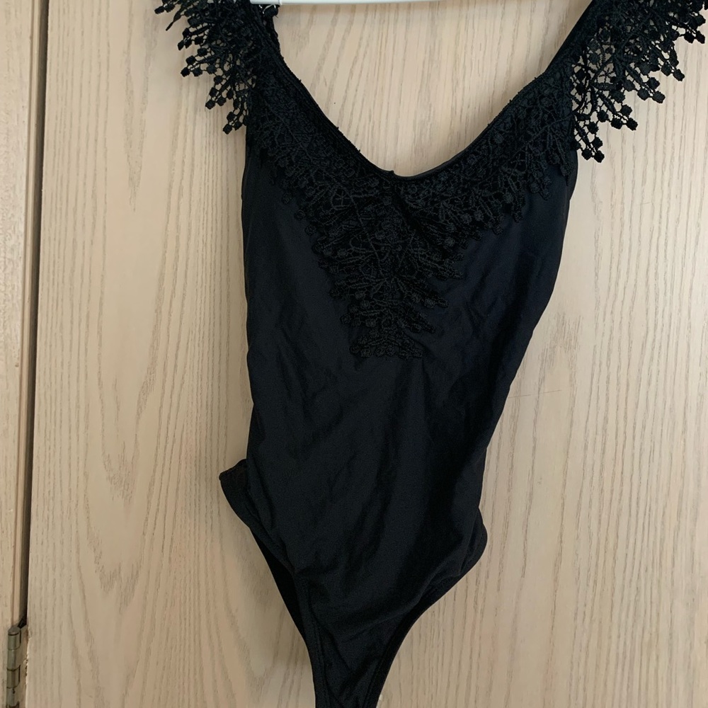 Brand new without tag gorgeous black swimming suit , one piece size S
